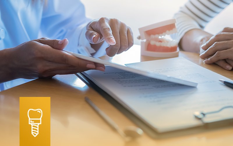 Two sets of hands are seen, one holding dental bills and pointing out details, the other patiently resting on the table. There is a model of teeth on the table between them. A graphic of an all-on-4 teeth implant is overlaid on the image.