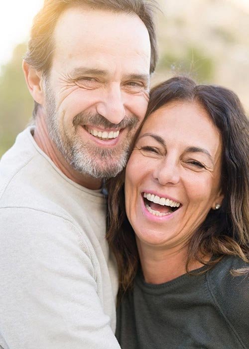 Smiling and laughing man and woman