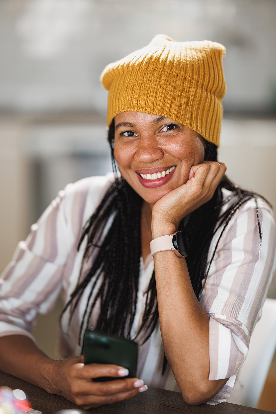 Smiling woman in a yellow beanie